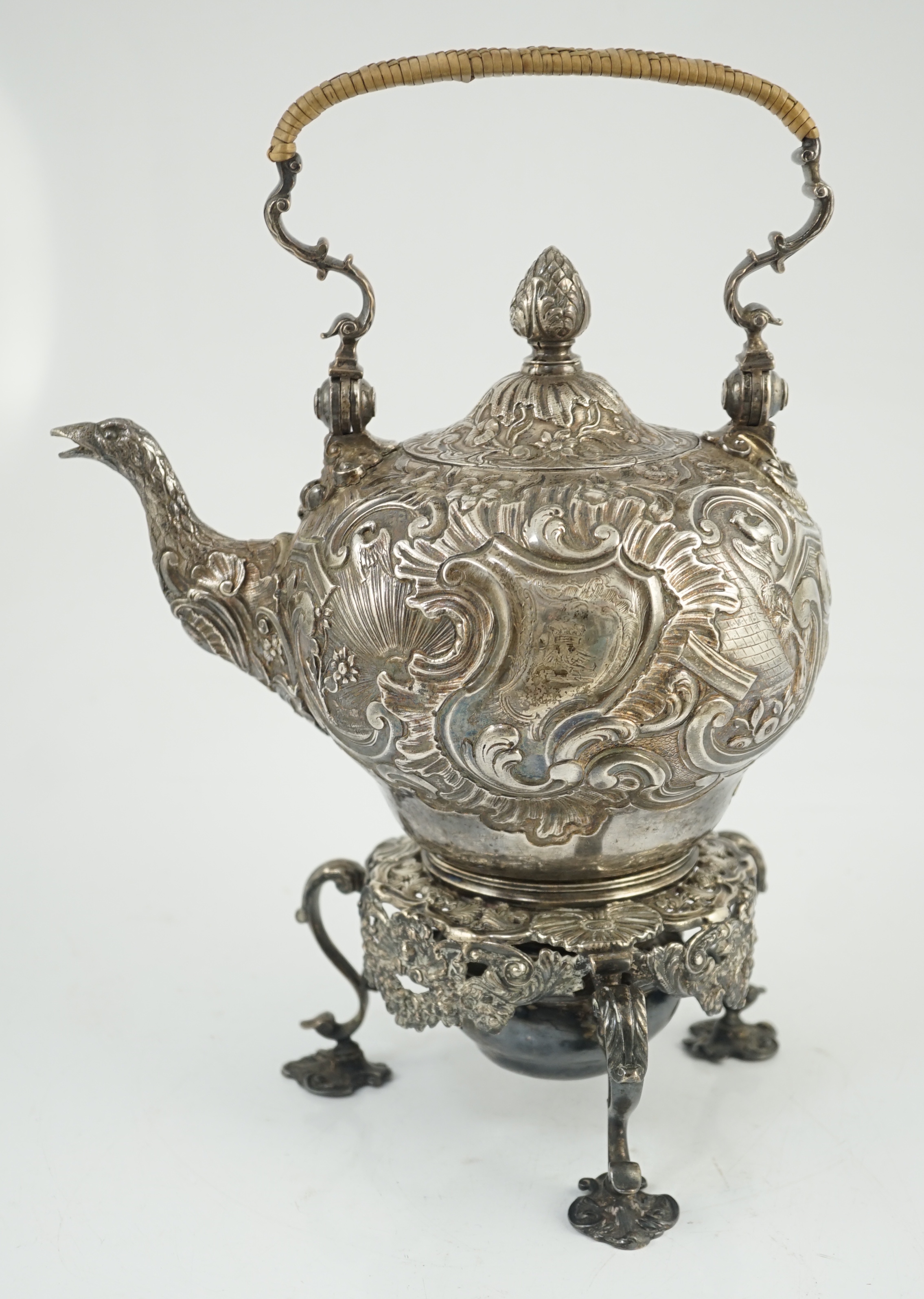 A George II embossed silver tea kettle on stand, with burner, by Francis Crump